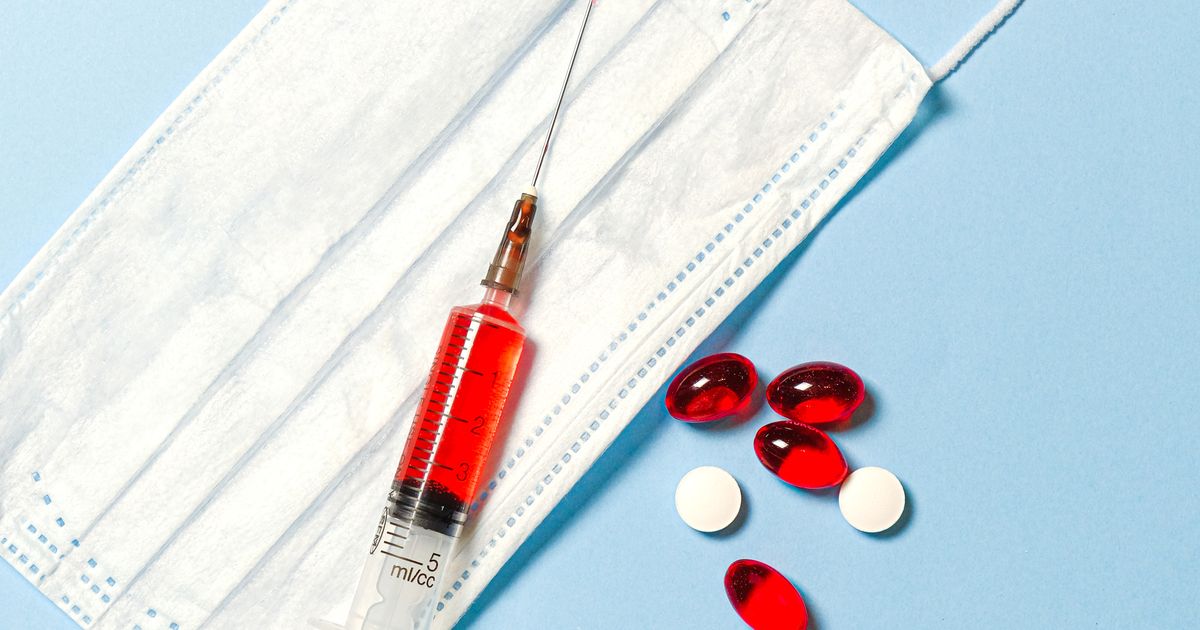 Seringa e medicamentos usados como apoio ao estudo de cálculo de medicação